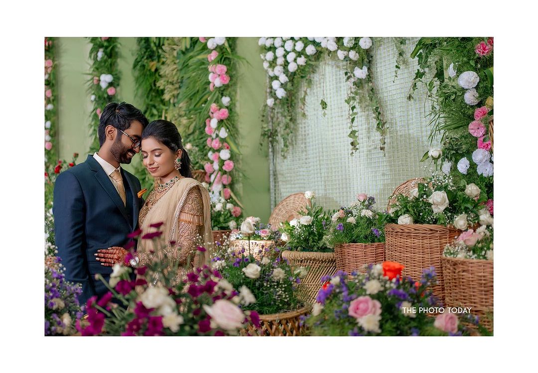 A South Indian couple's wedding in a flower garden, captured beautifully in this romantic photoshoot.